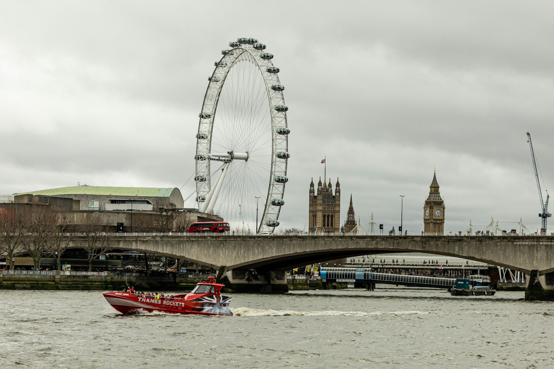 The London skyline across the River Thames, showing the London Eye and the Houses of Parliament